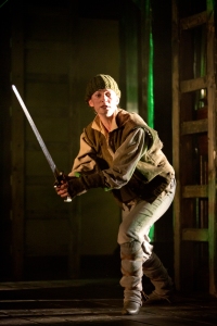Katie deBuys as the Boy. Here, fretfully in the midst of battle. Photo by Scott Suchman.